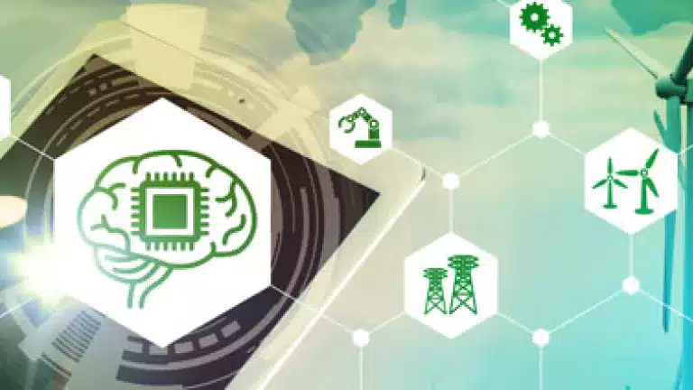 A hand interacts with a digital tablet displaying a brain-shaped microchip icon, surrounded by green technology symbols like wind turbines, gears, and wireless signals, with wind turbines in the background, representing smart technology and renewable energy integration.